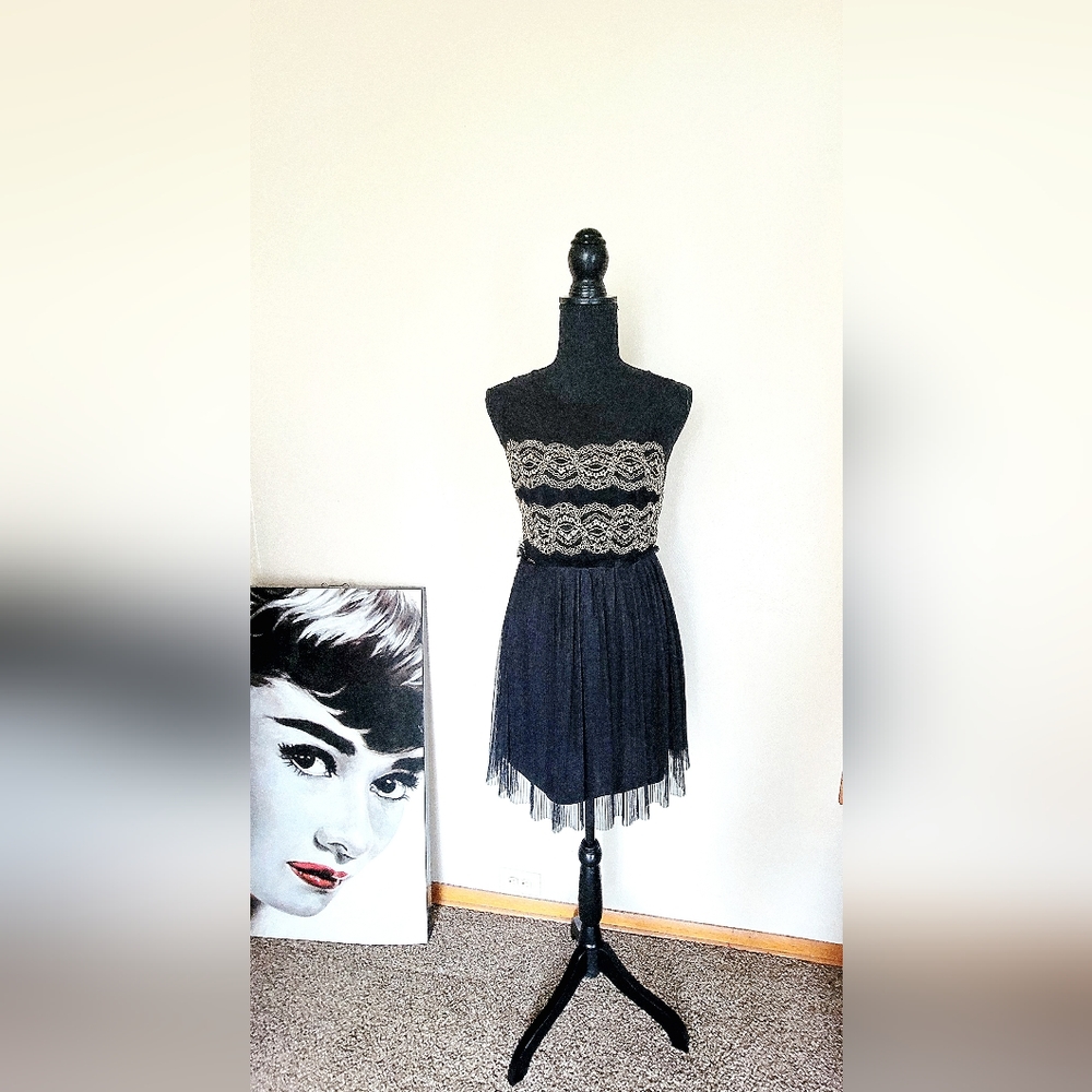 En creme black and gold mini unique dress. Size S